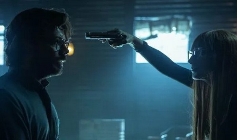 Alicia Sierra holding a gun on Professor in "Money Heist" scene