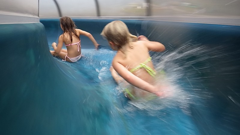 Young girls going down the waterslides