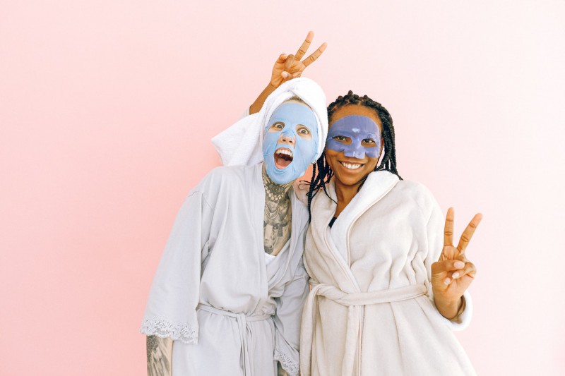 Women with face masks posing.