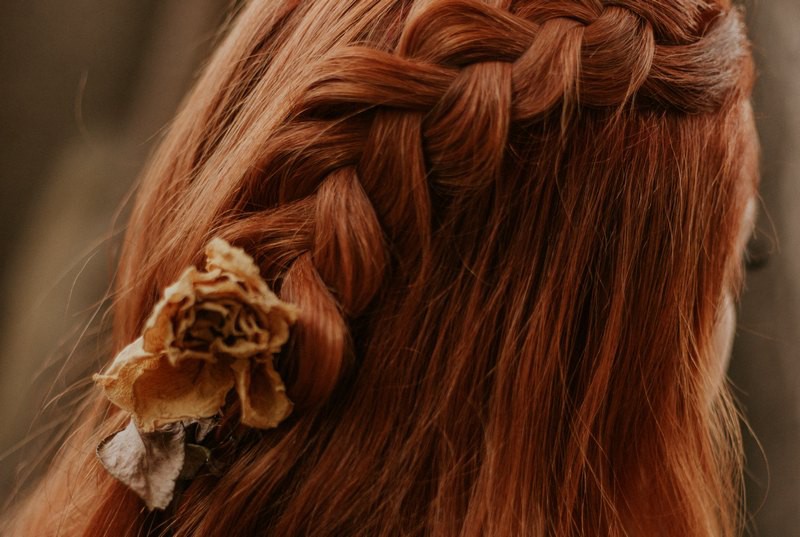 Redheaded girl with casual braid hairstyle