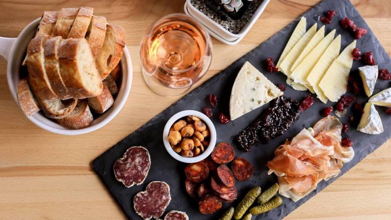 Antipasto platter served with a glass of Rosé.