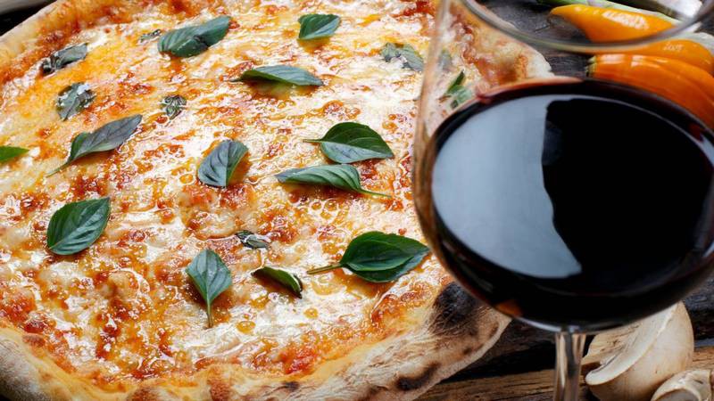 Margherita pizza served with black wine.