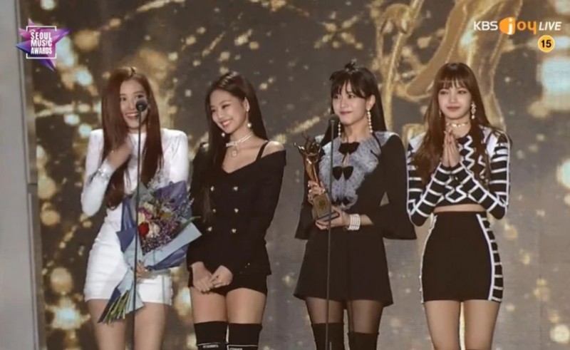 BLACKPINK on stage receiving an award