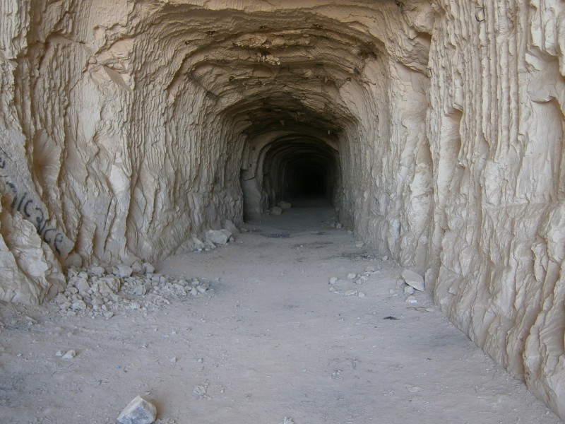 A tunnel with stone walls.
