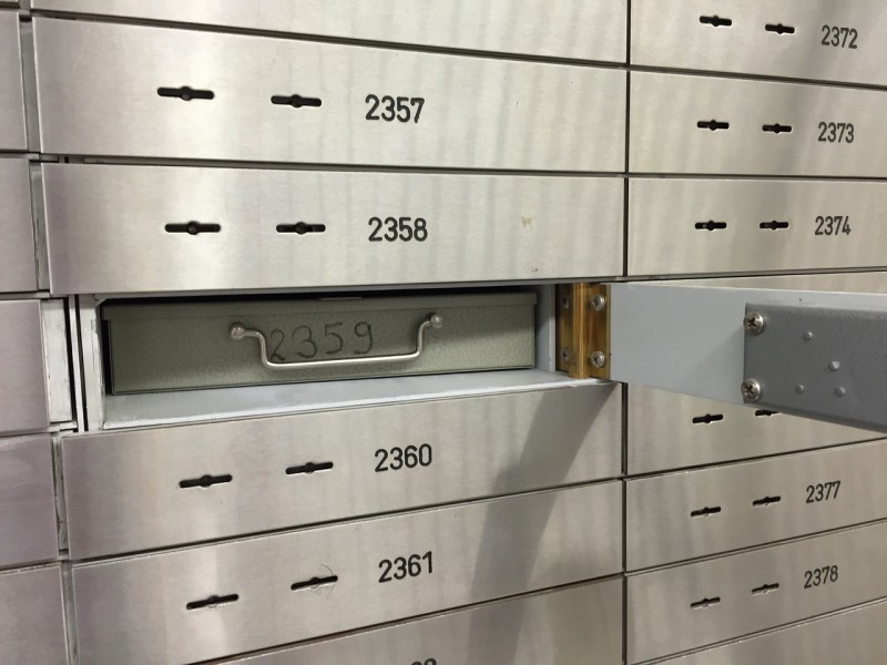 Opened deposit box in a bank safe.