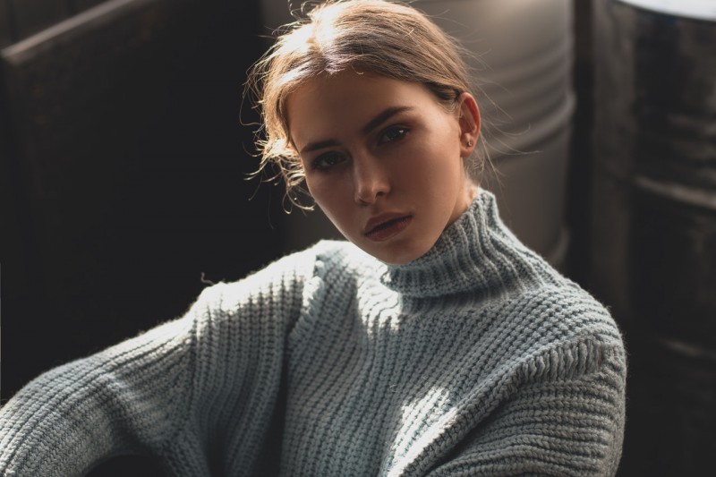 Young woman in a turtleneck sweater