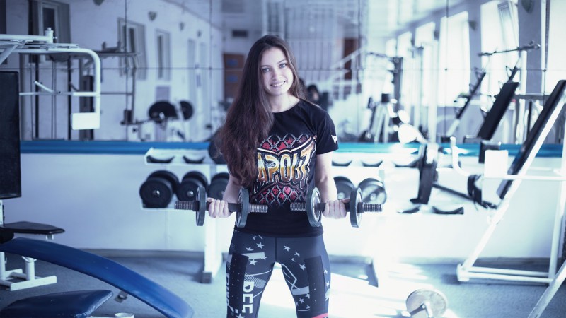 A young woman working out in the gym