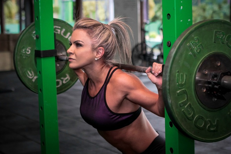 Young woman lifting weights