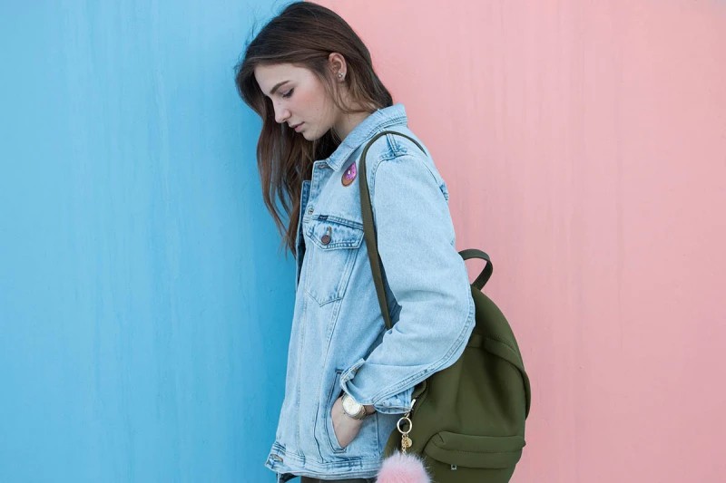 A young woman wearing denim jacket