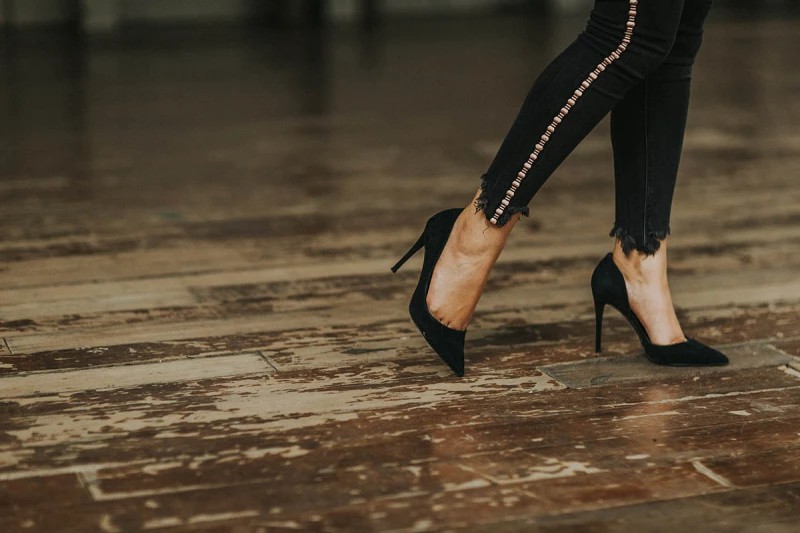 A woman in black high heels 