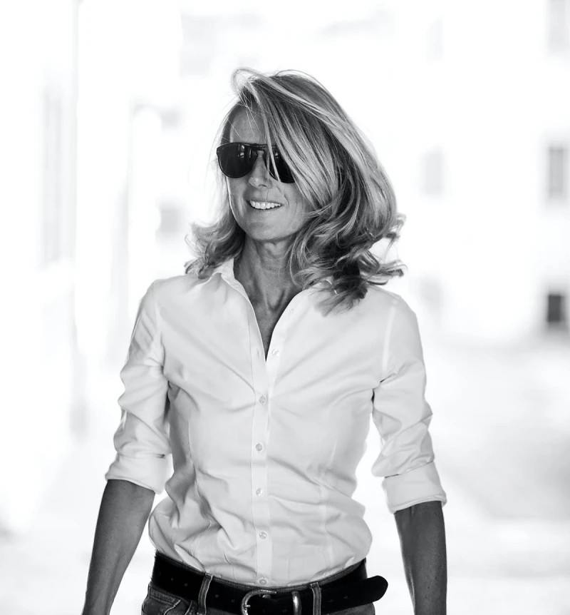 A woman wearing a white collared shirt