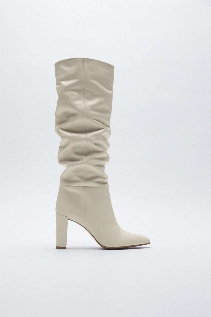 A white knee-high boot