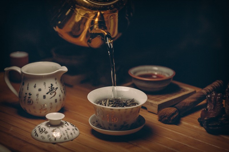 Pouring tea in a cup
