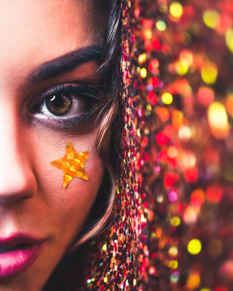A girl with star glitter on her cheek