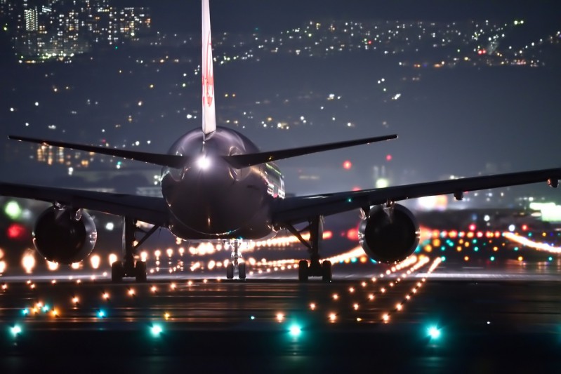 An airplane landing at night