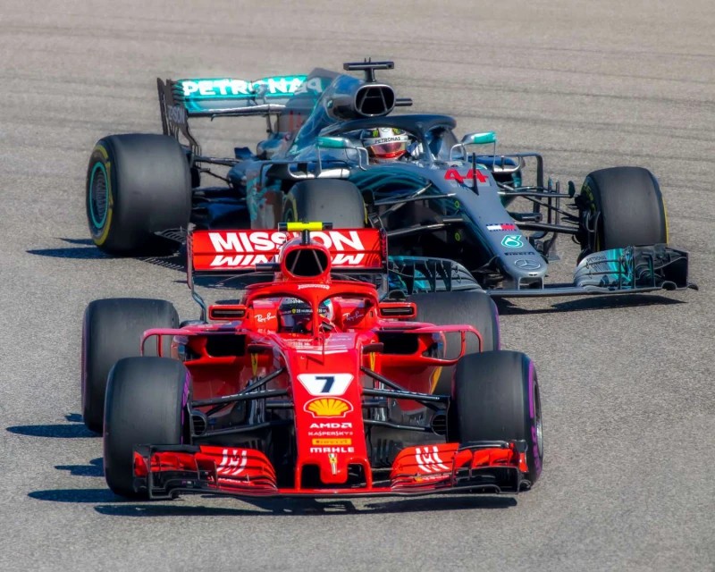 Ferrari and McLaren Formula 1 cars on the track