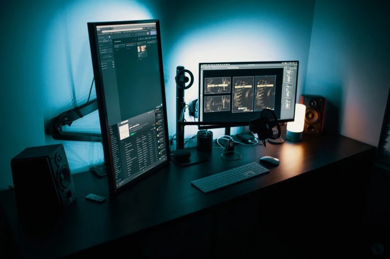 Elegant PC setup with two monitors, with one of them in pivot position.