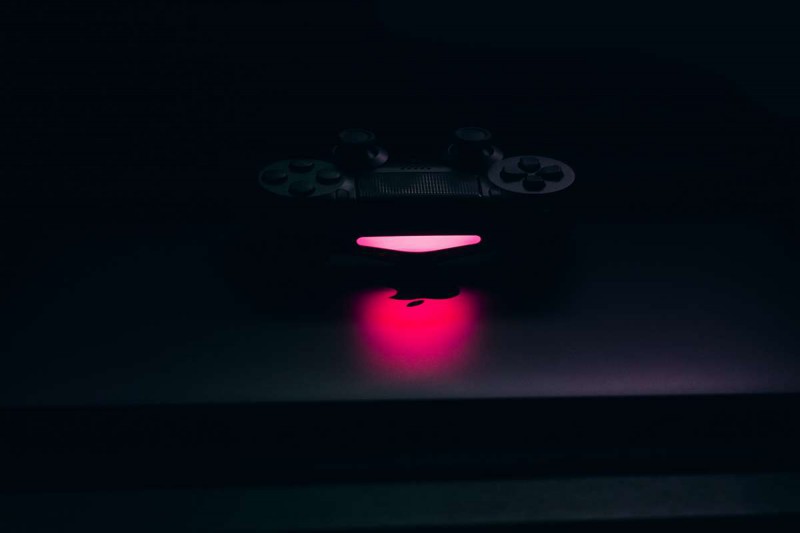 PlayStation 4 controller illuminating light in the dark