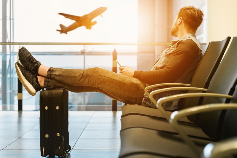 A man waiting for his flight at the airport