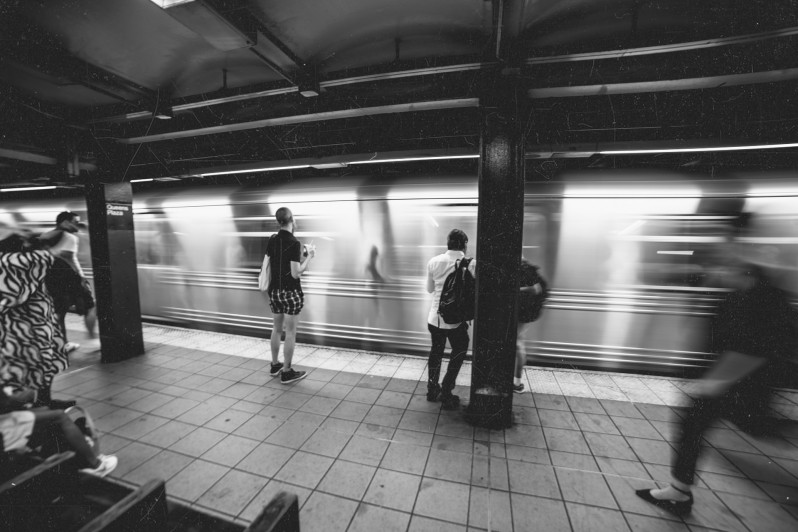 People in a subway waiting for their ride