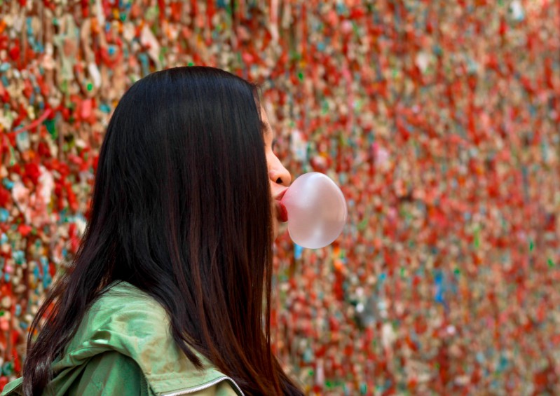 A girl making a gum baloon