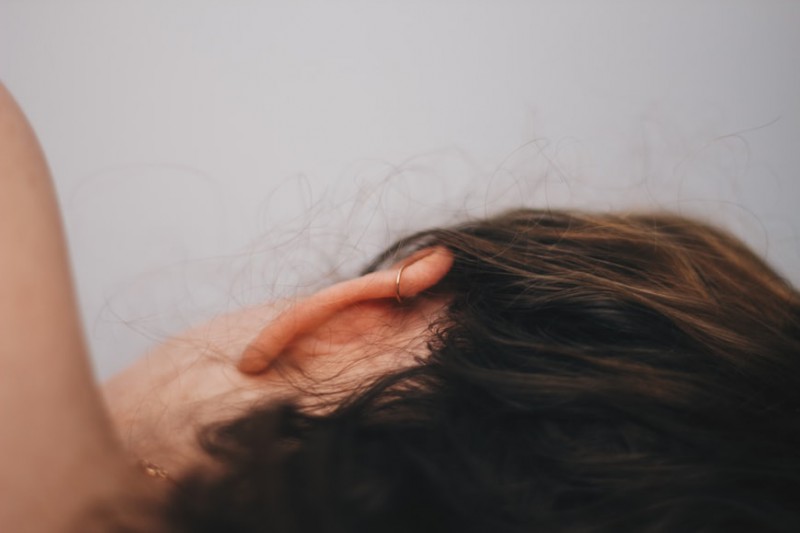 A look at woman behind her ear