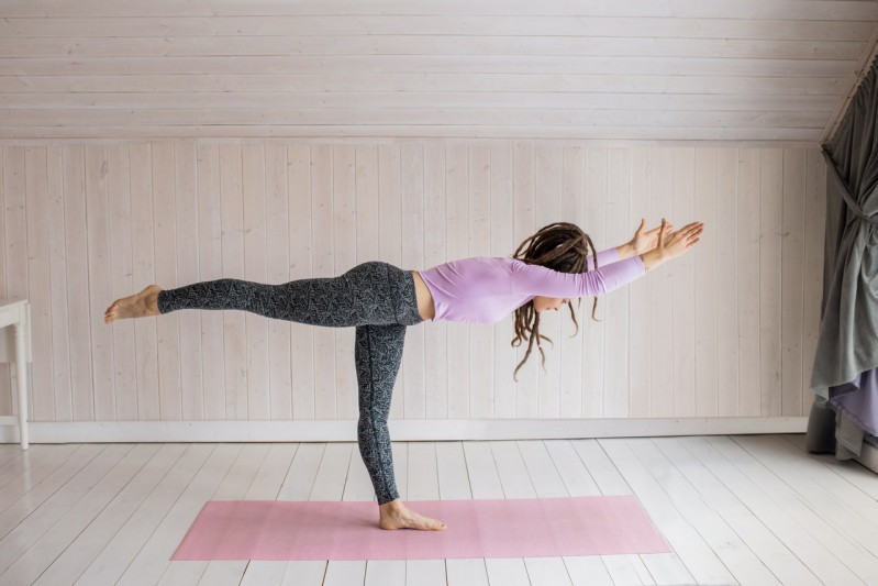 A girl doing yoga stance