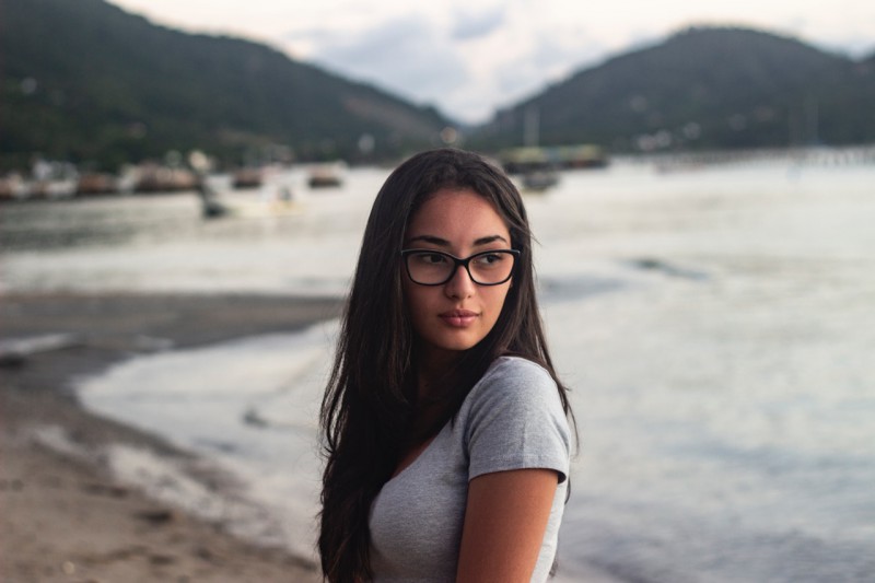 Girl with glasses on the beach